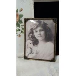 Oude fotolijst met bolglas