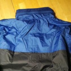 Nieuw! Regenpak in tasje. Jas L broek M