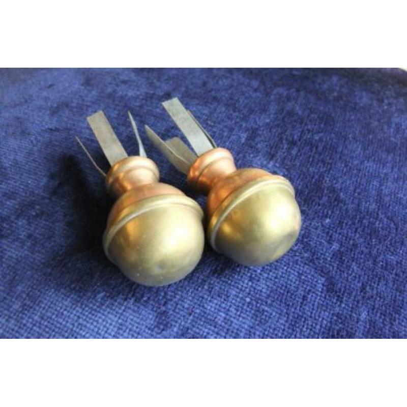 2 koperen gordijn roedestoppers.