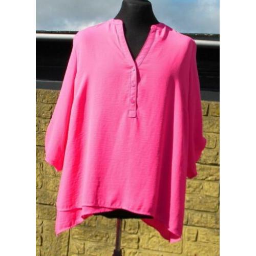 Zuurstok roze tuniek van Canda maat 48