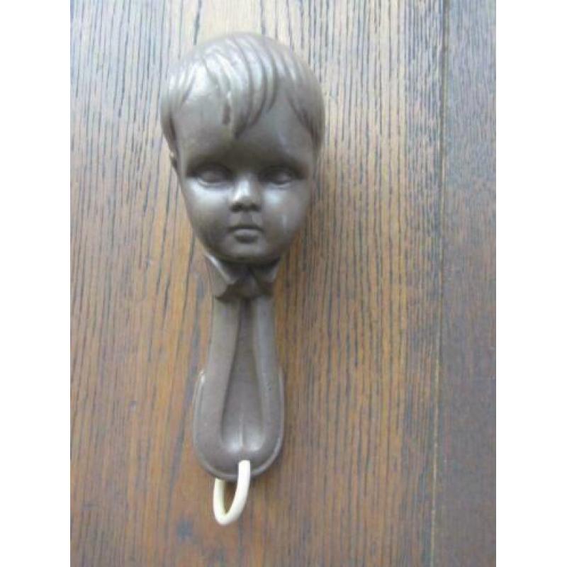 Oude celluloid rammelaar gezicht 17 cm