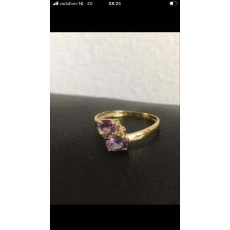 Prachtige NW 9 krt gouden ring met 2 facet gesl. amethisten