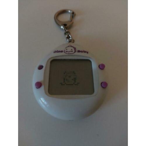Japanse Dino Baby tamagotchi wit met paarse knopjes
