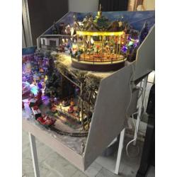 Kerstdorp met veel bewegende dingen en lampjes