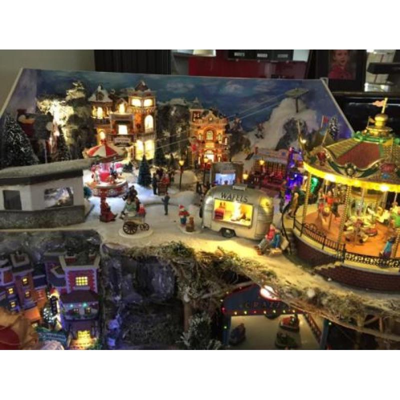 Kerstdorp met veel bewegende dingen en lampjes